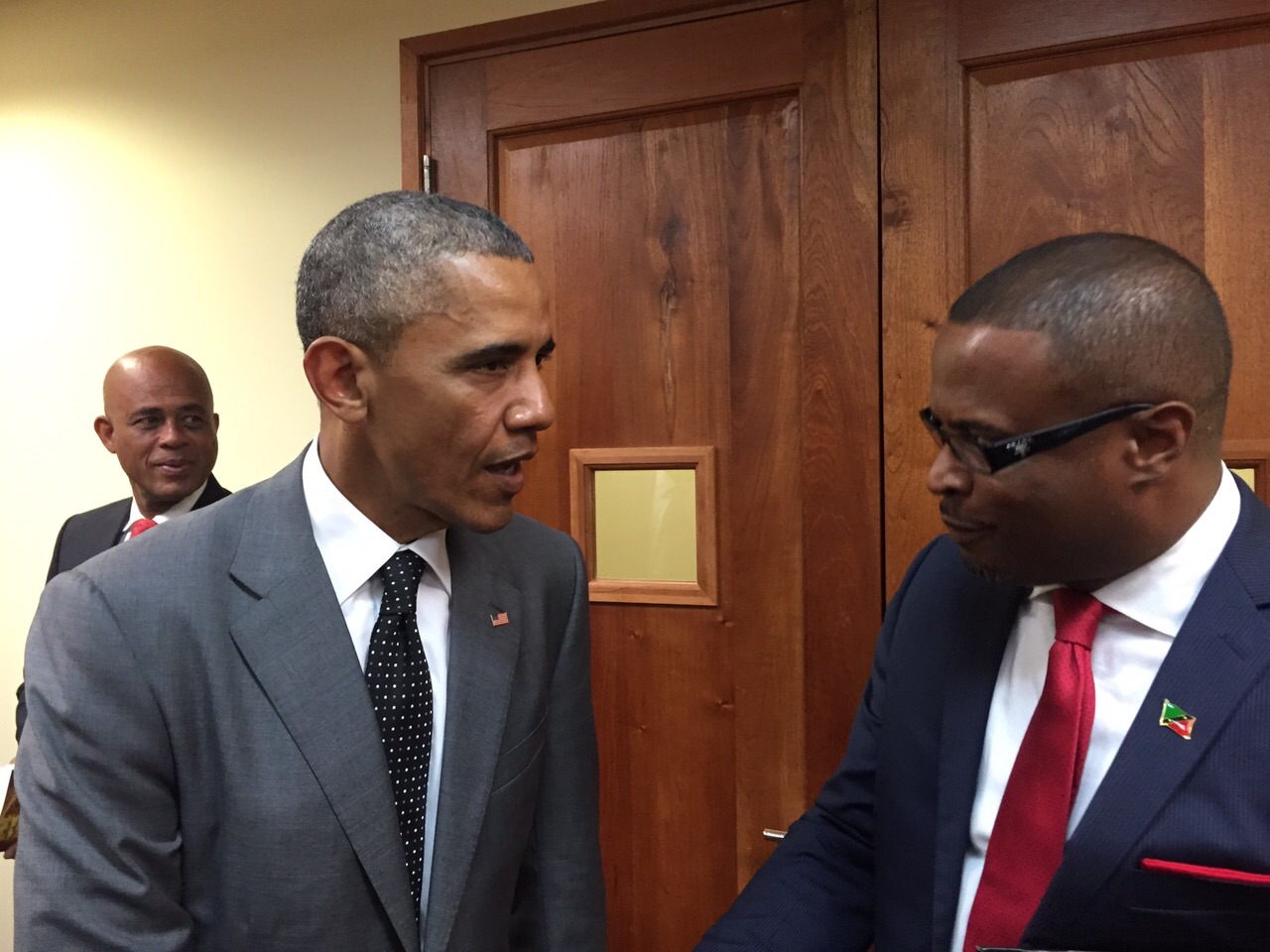 Federal Minister of Foreign Affairs and Deputy Premier of Nevis Hon. Mark Brantley (right) speaks with United States of America President Barack Obama during the US-CARICOM Summit in Jamaica on April 09, 2015